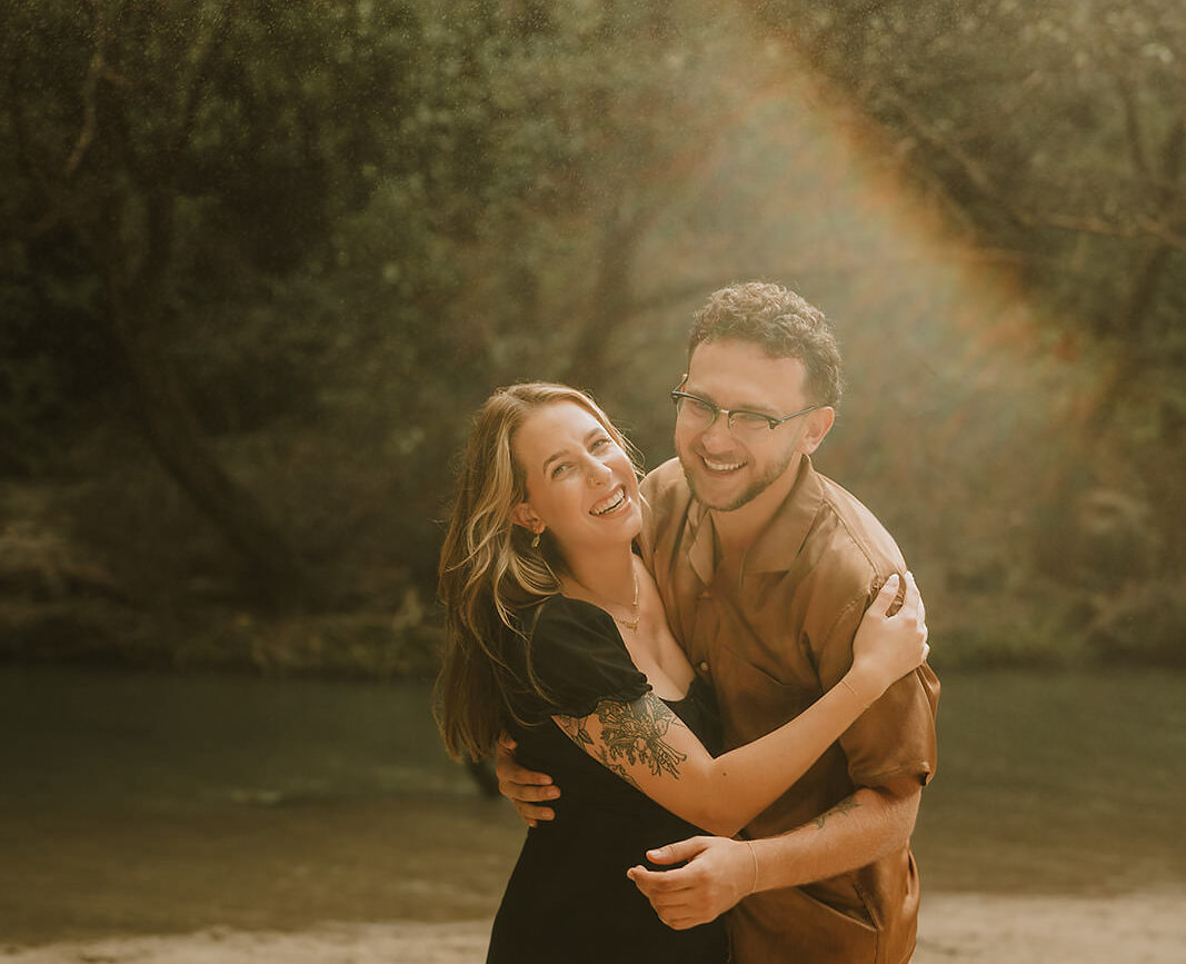 costa rica A man and woman capturing their love in an intimate embrace amidst the tropical rain during their engagement photoshoot in Costa Rica, expertly captured by a talented engagement photographer.