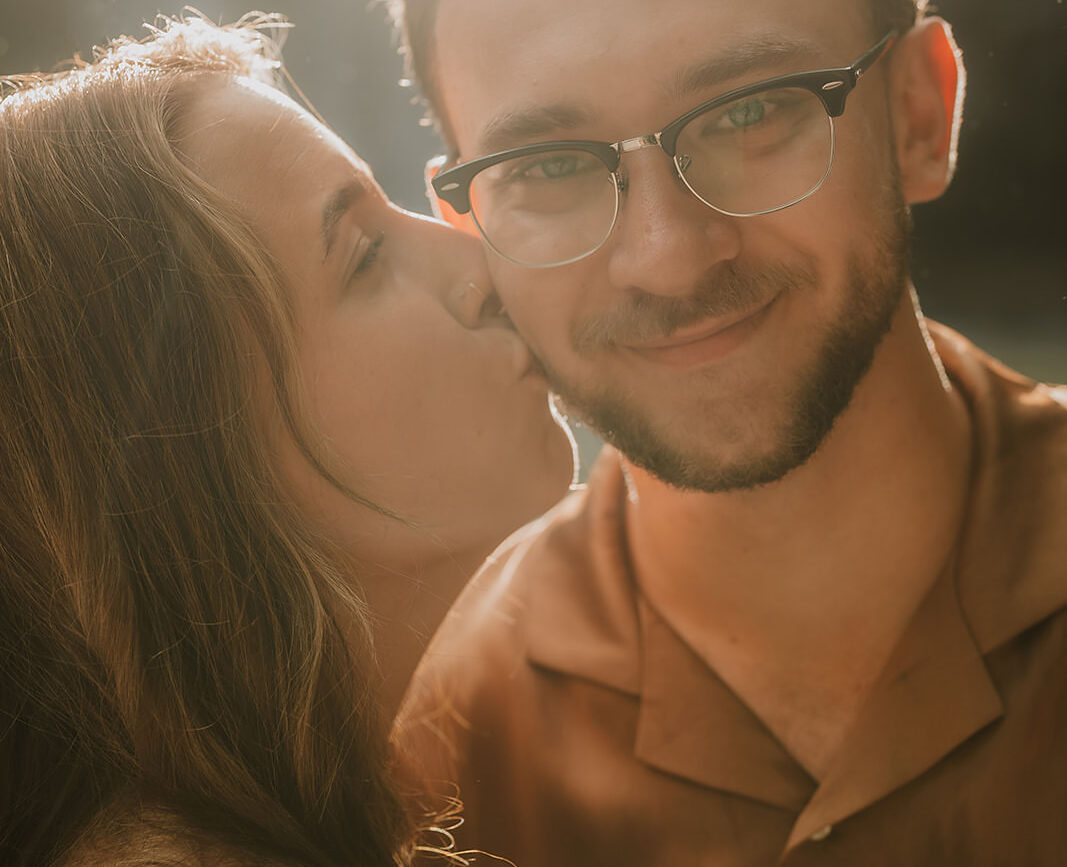 costa rica An engaged couple sharing a passionate kiss during their Costa Rica engagement photoshoot, captured by a talented engagement photographer.