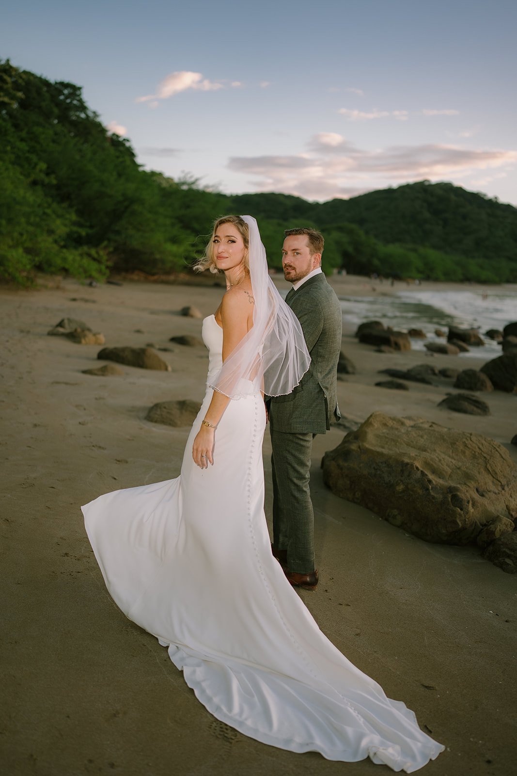 Bride and groom at sunset on Playa El Jobo at JW Marriott Costa Elena, La Cruz, Guanacaste, Costa Rica.