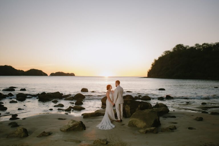 Bride and groom on Playa El Jobo at JW Marriott Costa Elena, La Cruz, Guanacaste, Costa Rica.