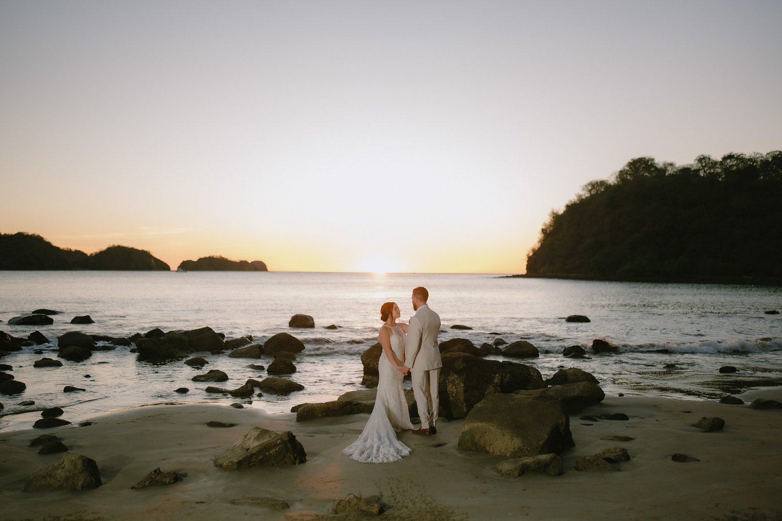 Bride and groom on Playa El Jobo at JW Marriott Costa Elena, La Cruz, Guanacaste, Costa Rica.