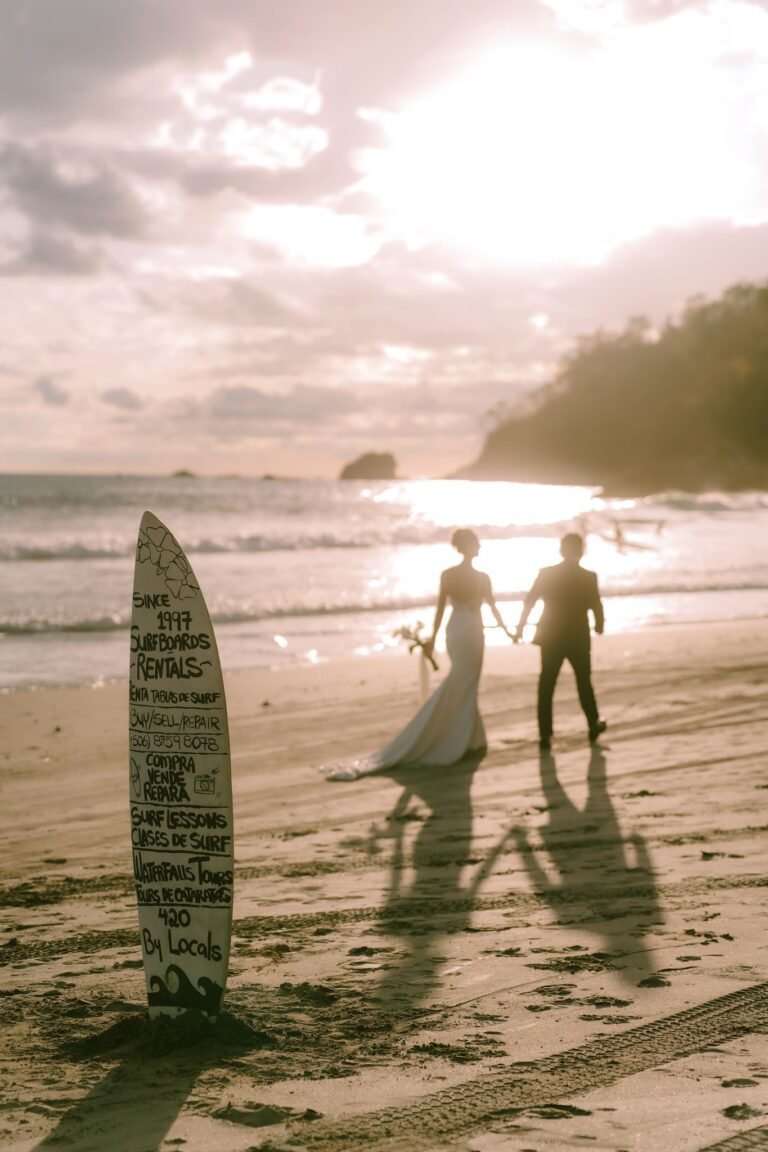 Best Documentary Wedding Photographers In Costa Rica | Adri and Lucas 7 Bride and groom walking a Manuel Antonio beach at sunset, Costa Rica
