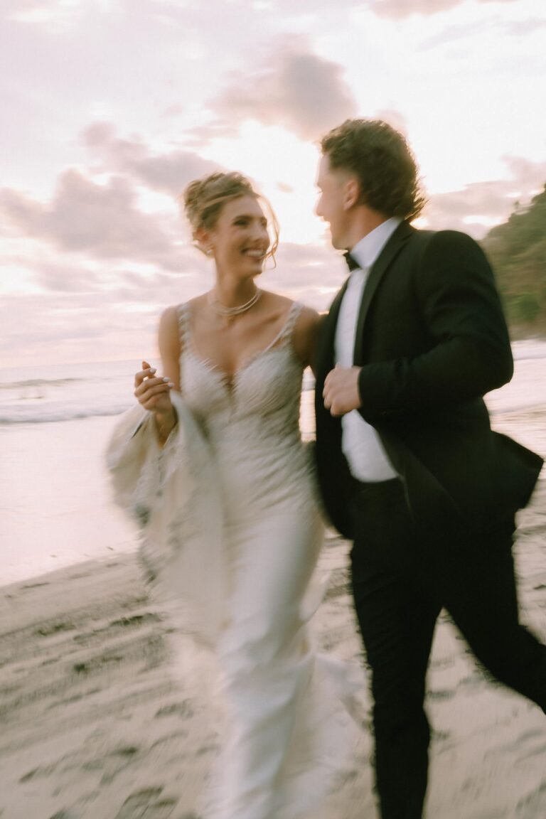 Best Documentary Wedding Photographers In Costa Rica | Adri and Lucas 10 Couple laughing together on the beach at golden hour in Manuel Antonio, Costa Rica