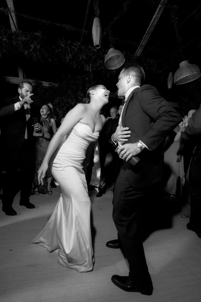 Best Documentary Wedding Photographers In Costa Rica | Adri and Lucas 13 Bride and groom laughing on the dance floor at a Costa Rica wedding reception