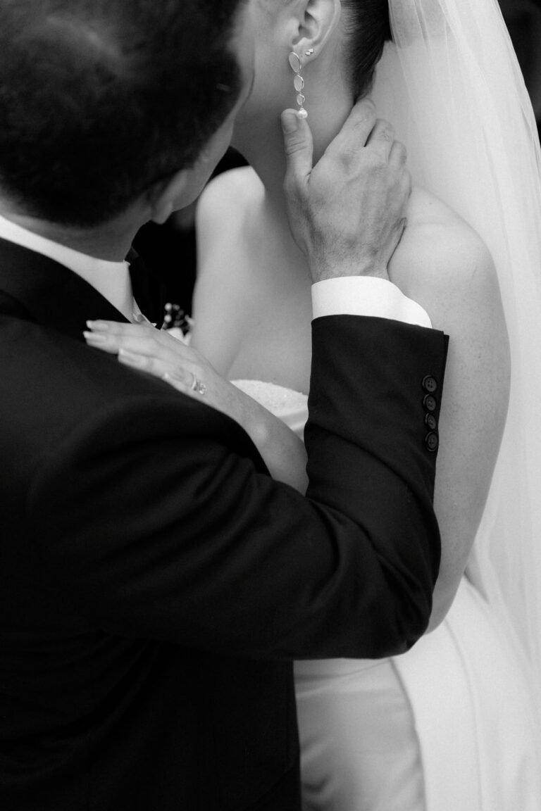 Black and white portrait of a couple embracing at their Costa Rica wedding