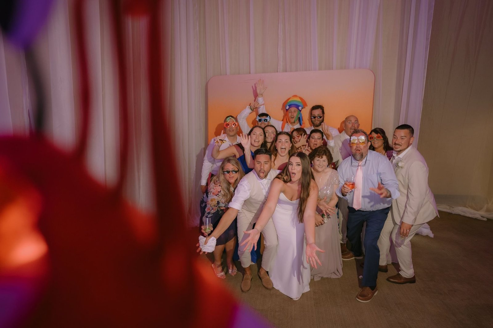 Wedding guests posing at the photobooth