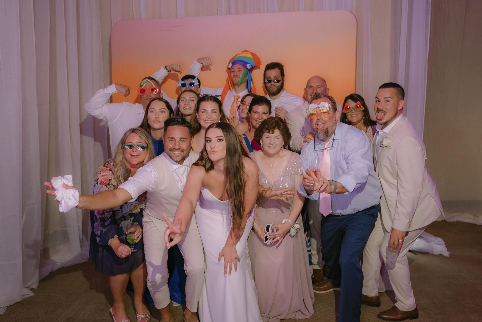 Wedding party celebrating at the photobooth