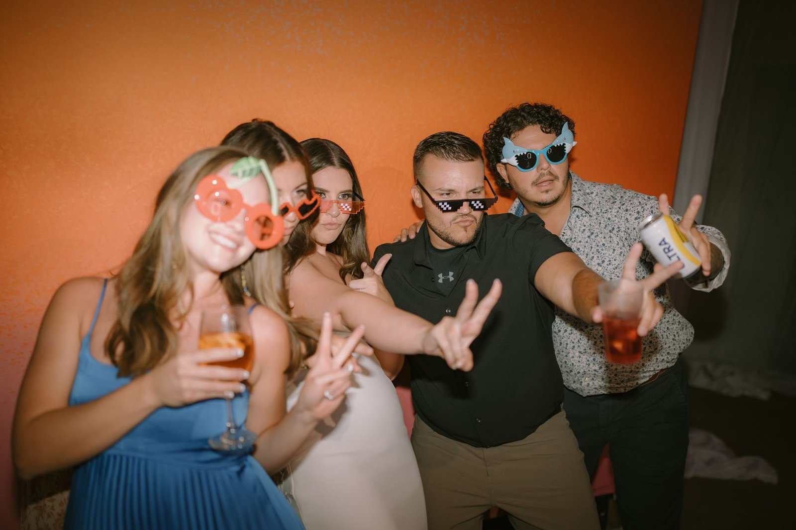 Friends in fun glasses at the photobooth